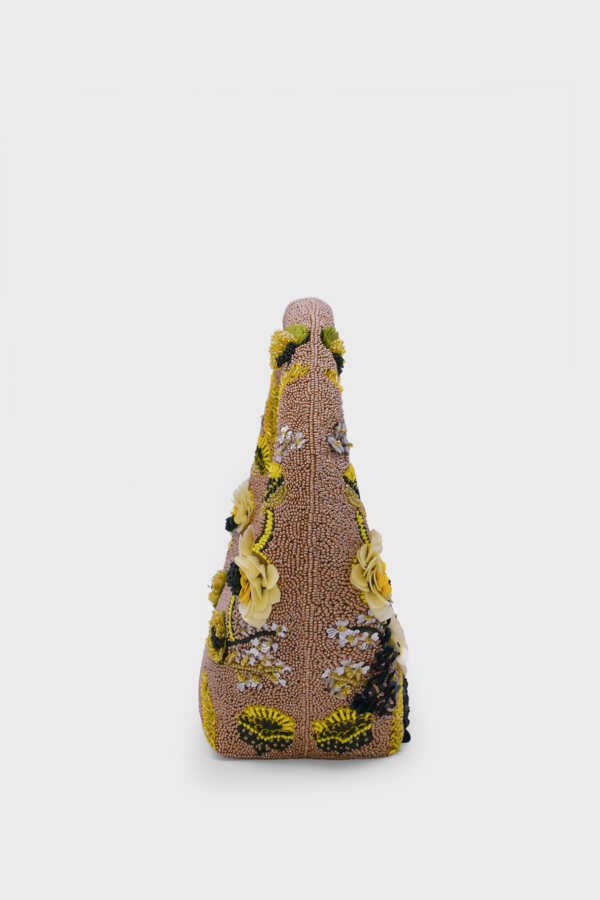 Side view of luxury embellished beaded shoulder bag in golden tones