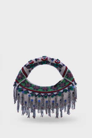 Woman styling Midnight Cascade Beaded Bag at evening event