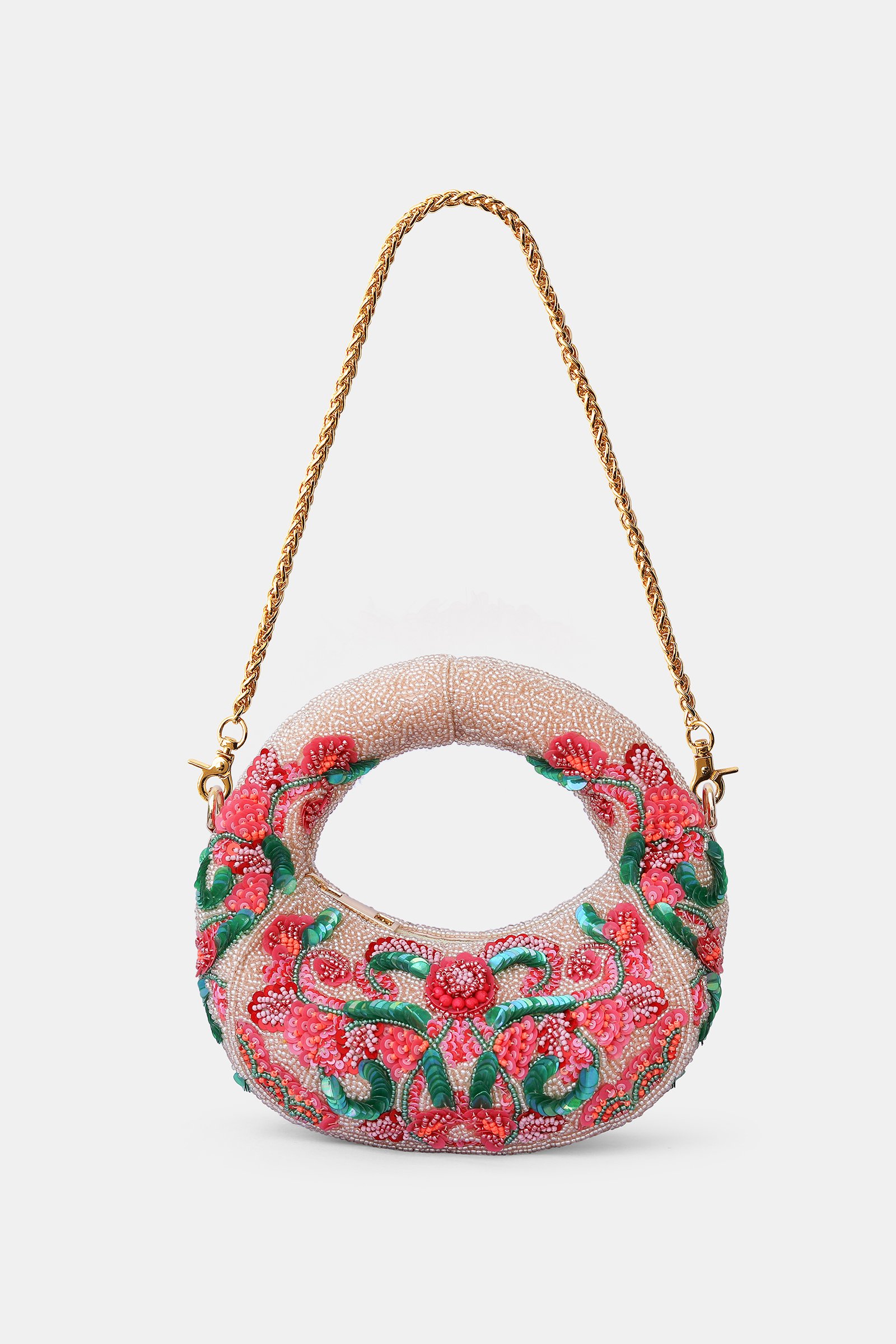 Orbelle Mini Bag Orbelle Mini Bag featuring intricate hand-beaded floral embroidery, pastel pink embellishments, circular silhouette, and a removable gold-finished chain handle.